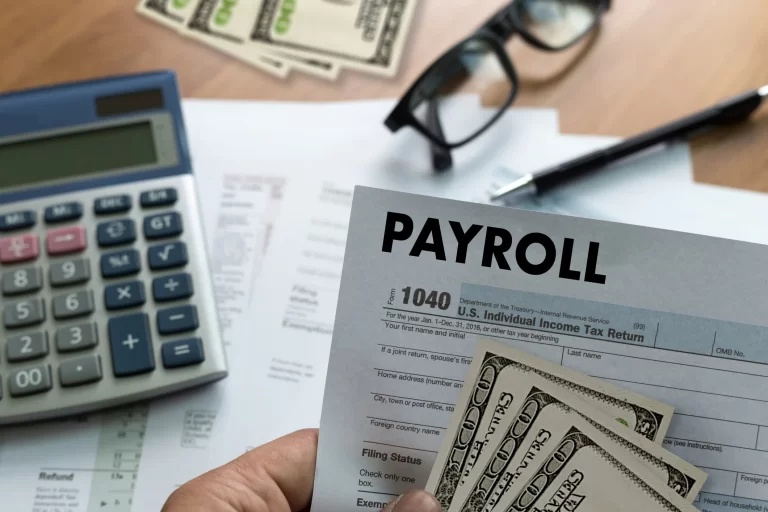 PAYROLL-Businessman-working-Financial-accounting-concept-690719352_2125x1416